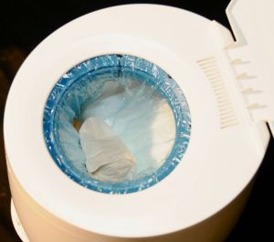 diaper genie essentials.  push-n-lock clamp to seal away odor.