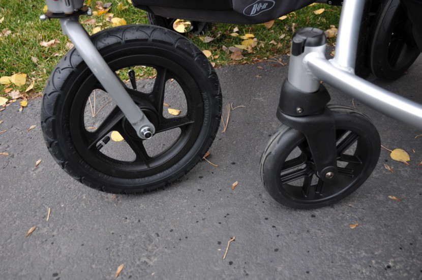 full size stroller - front-wheel comparison. the bob revolution on the left is a...
