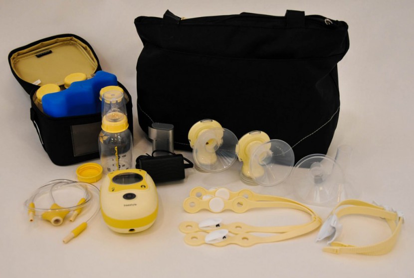medela freestyle - components, including the yellow "hands-free" straps that connect it...