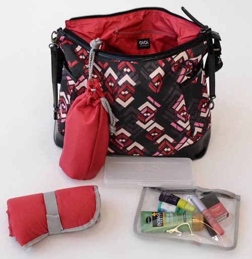 the oioi hobo diaper bag and included accessories: changing pad...