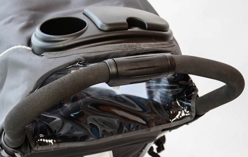 graco duo glider - adult cup holder is relatively shallow and located in a high lace...