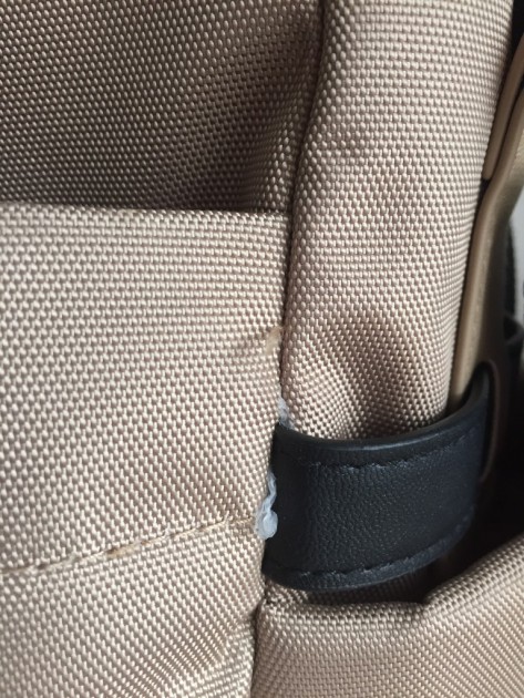 we couldn't help but notice a few loose ends on this bag. besides...