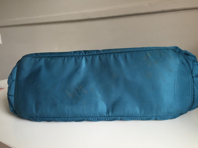 bottom of the forma. no feet but the fabric bottom was easy to clean...