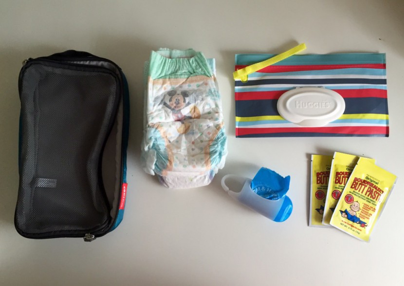 what we fit into the interior mesh bag: 3 size 4 diapers, a travel...
