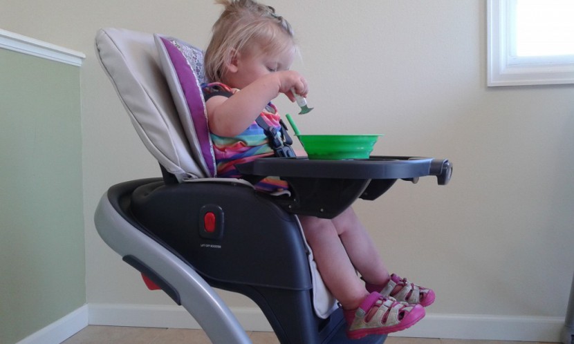 graco blossom - baby enjoying a meal in the versatile graco blossom.