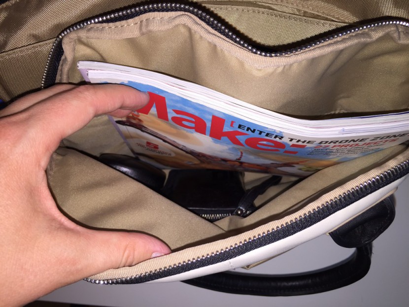 the front pocket of the chelsea is tall enough to fit magazines...