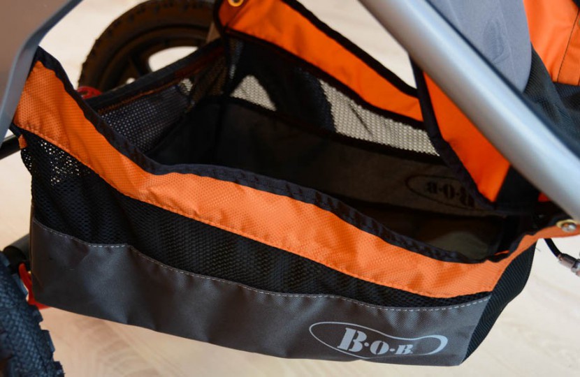 bob sport utility - the under seat storage bin does hold a large diaper bag, but it is...