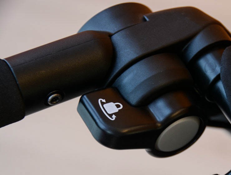 chicco tre - the front swivel wheel can be locked in place using this locking...