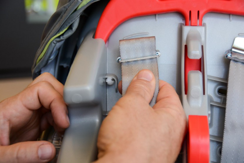 infant car seat - the strangely placed rear tightening and loosening system on the...