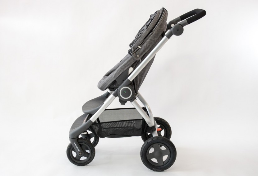 the stokke with the seat back up and the canopy closed.