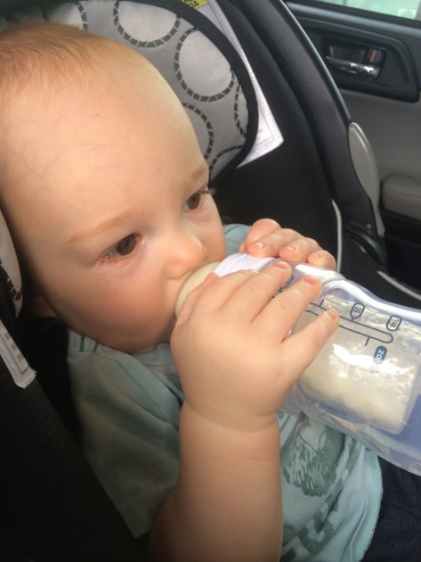 playtex nurser - 4 month boy grasping and drinking from the wide mouth playtex...