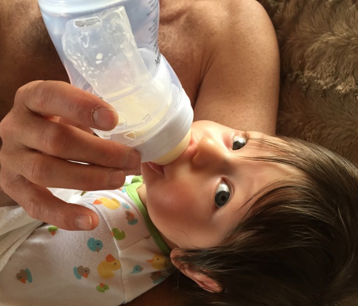 playtex nurser - 15 week, 14 pound baby boy drinking from playtex nurser.