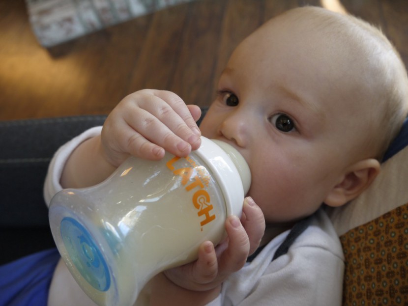 munchkin latch - you can see the bottom of the bottle in this photo where the...