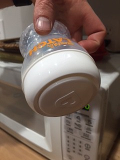 munchkin latch - the mouth of the munchkin latch with the storage cap in place of the...