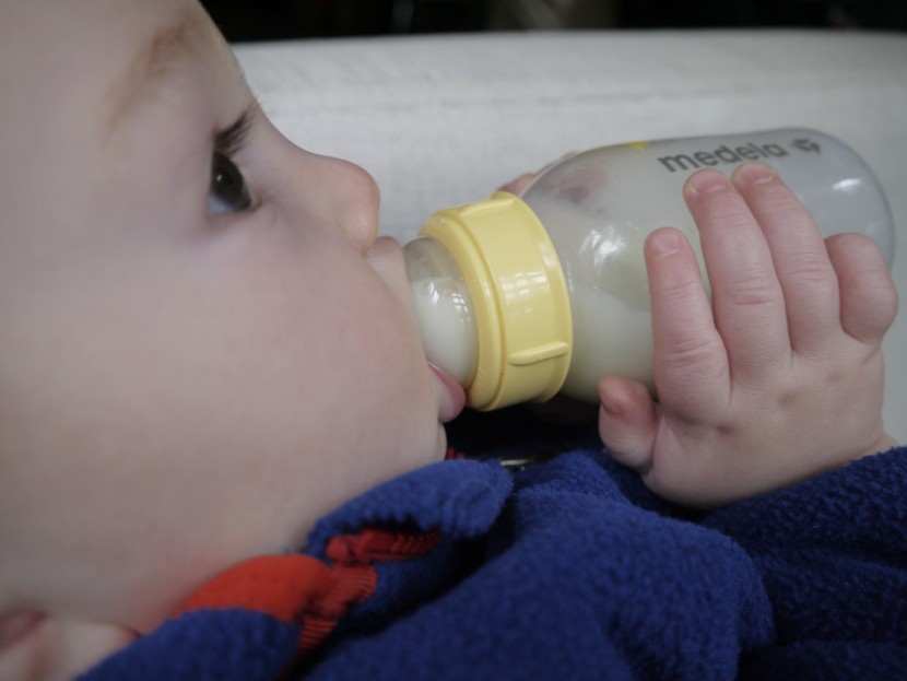 medela breastmilk - four-month-old, 15.5-pound baby boy drinking from the medela...