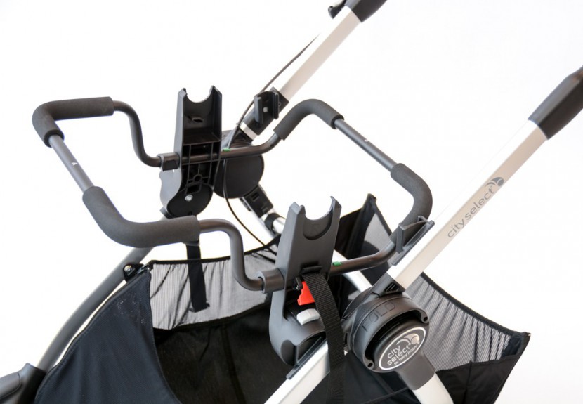 baby jogger city select - the select uses a click in and the strap installation method.