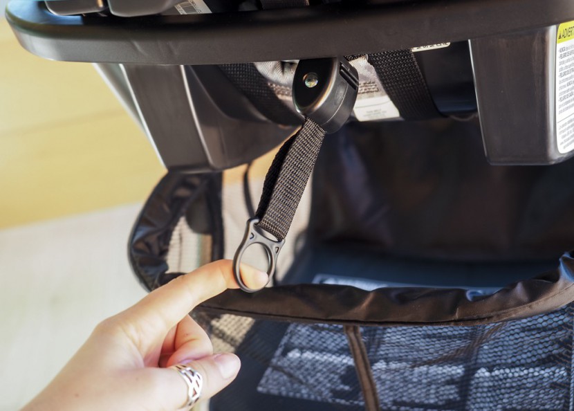 baby trend snap-n-go ex universal - the adjustment toggle for the under the seat straps on the baby...
