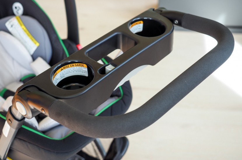 graco snugrider elite - the parents console on the snugrider has 2 shallow cup holders and a...