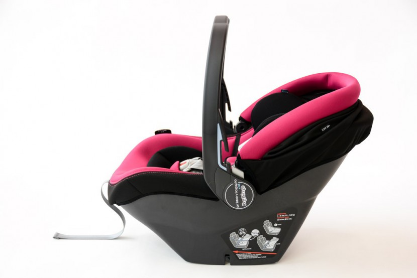 infant car seat - this shows the peg perego seat with the carry handle in the upright...