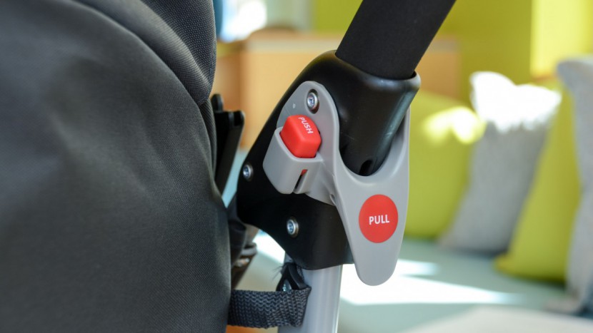 the graco fold is initiated with a push of a button and the pull of...