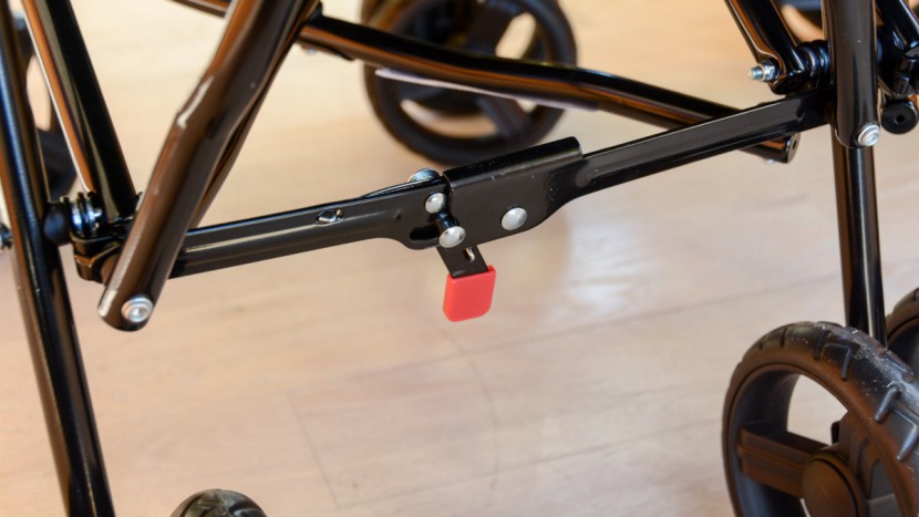 delta children lx side by side - unlocking the delta frame to fold requires shifting a very stiff and...