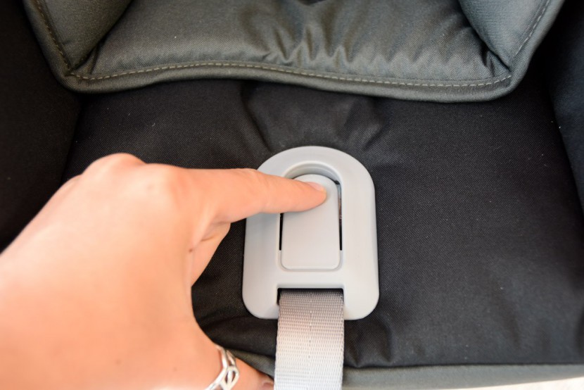 infant car seat - to adjust the harness on most seats, you use the pull strap to...