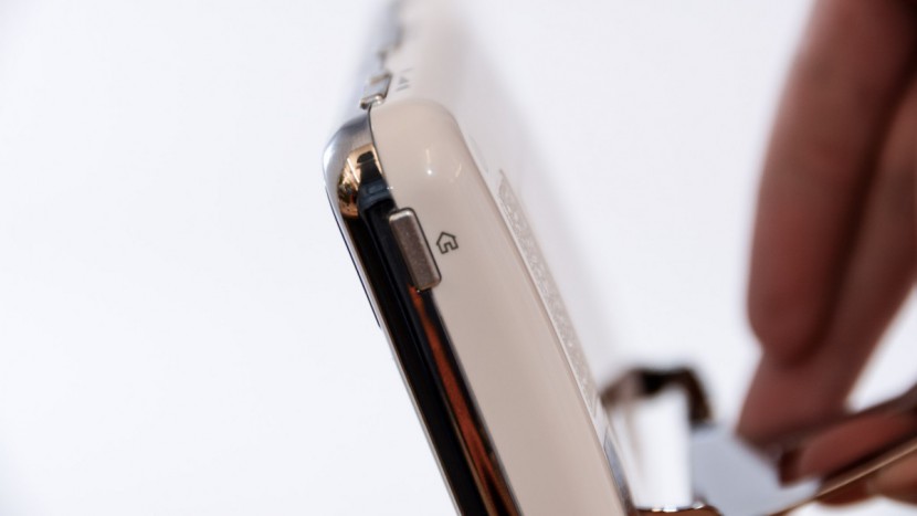 summer infant baby touch - pressing the home button on the side of the summer infant baby touch...