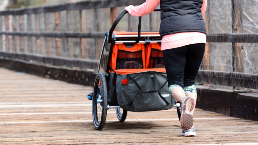 thule chariot cross 2 with jogging kit - the stow pockets on the back of the seats are easy to access when...