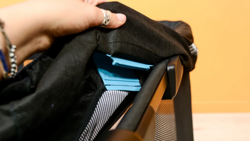 the mesh and fabric cover that creates the walls clips in place over...