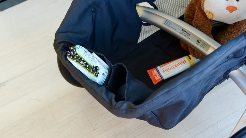 full size stroller - the inside of the uppababy vista storage bin has several individual...