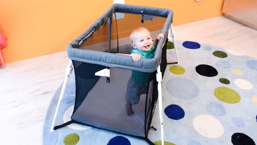 travel crib - the lotus is lightweight and has a hands free carry bag.