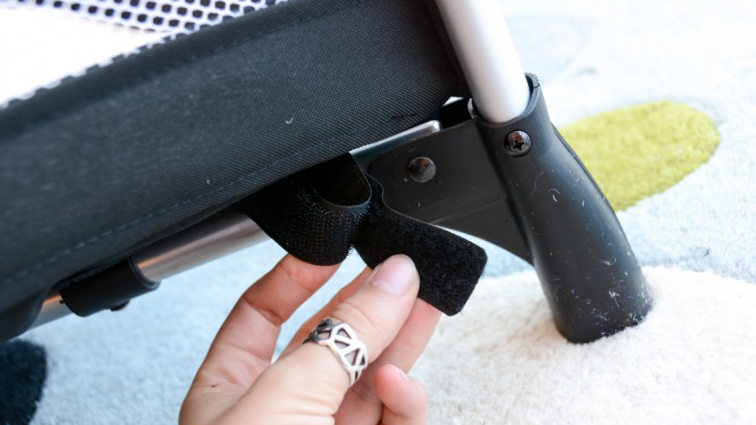 the mattress of the graco secures to the bottom of the crib with...