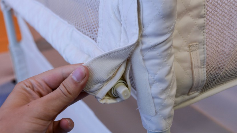 arm's reach clear-vue co-sleeper - the fabric on the side walls secures to the end fabric with velcro...