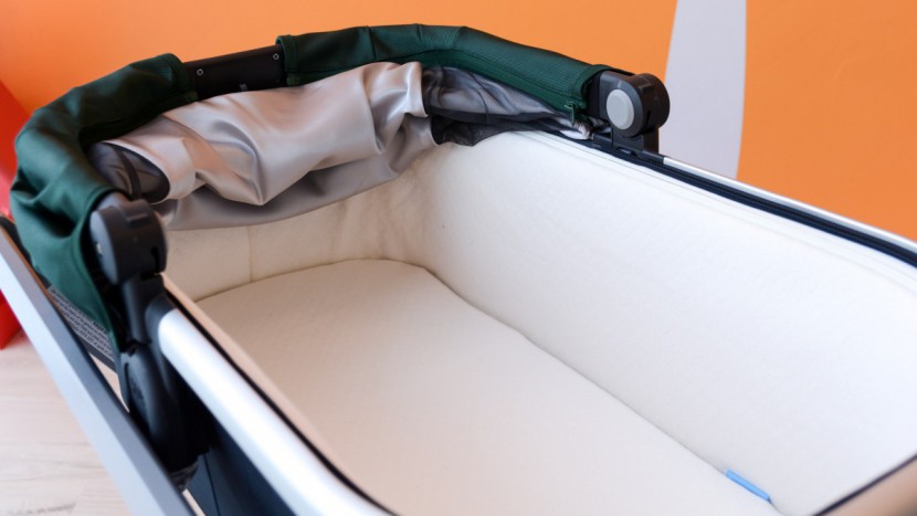 the uppababy has a cushioned fabric liner on the inside and a canvas...