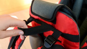 The Clevr has a single handle on the opposite side of the drool pad...