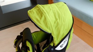 The Kiddy canopy is attached to the pack and fits in a pocket on the...