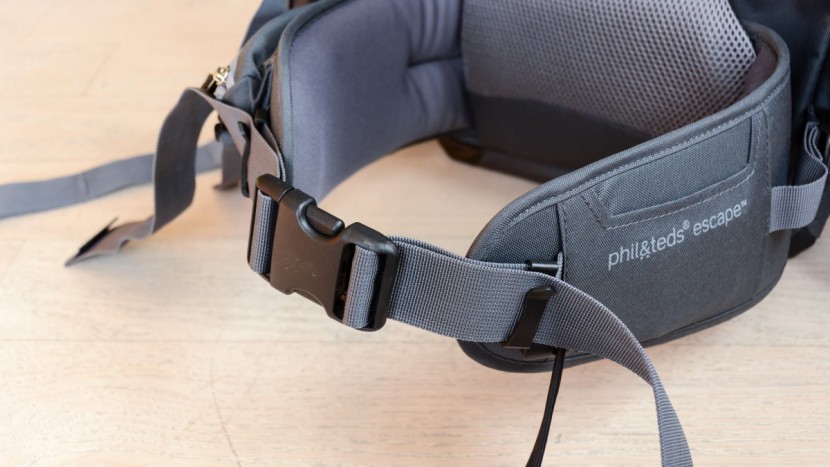 the escape has a stiff waist buckle that is difficult to squeeze...