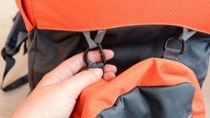 Detaching the Parade child's pack requires sliding the loop through...