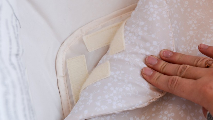 graco dream suite - the pad of the dream suite is secured to the bassinet floor with...