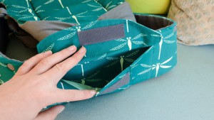 The Beco waistband pocket has a Velcro closure and can hold some...