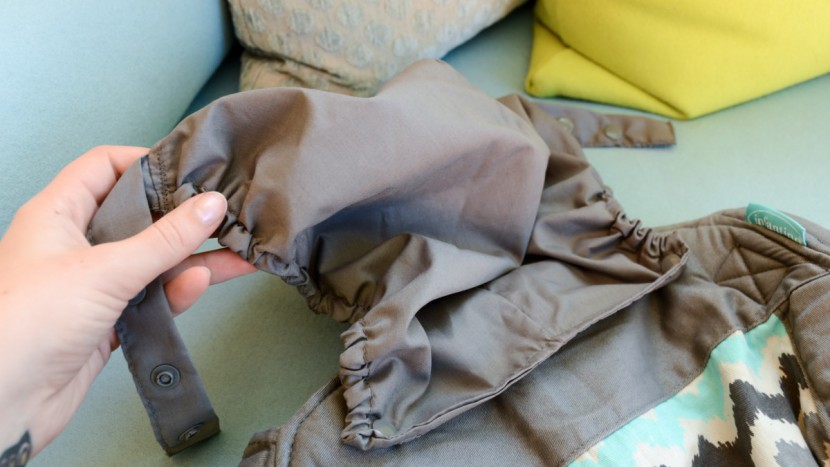 infantino sash - the sash has a removable hood that can provide additional head...