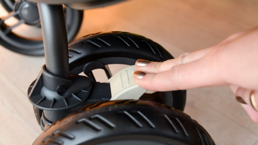 joovy scooterx2 with tray - while the scooter's front wheels swivel and can be locked in place...