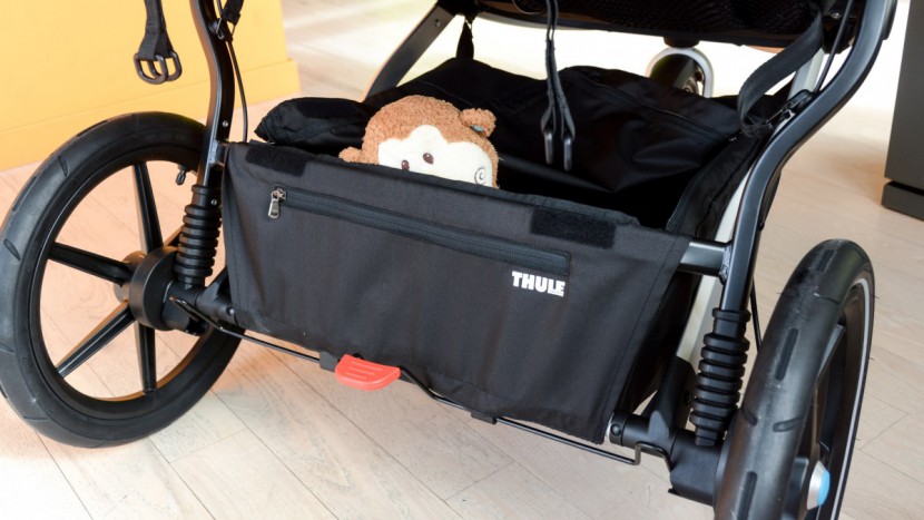 the urban glide double has a storage bin with zippered closure and...