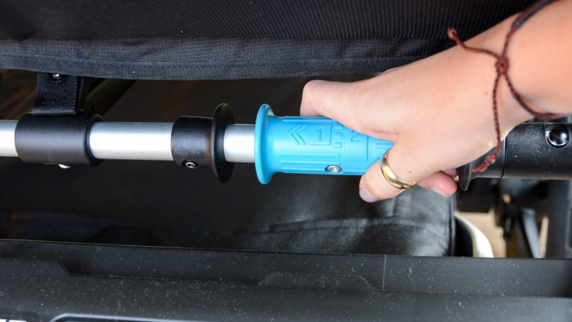 the folding handle on the urban glide double is under the seat and...