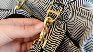 The clasp makes it easy to remove straps for alternate carry styles.