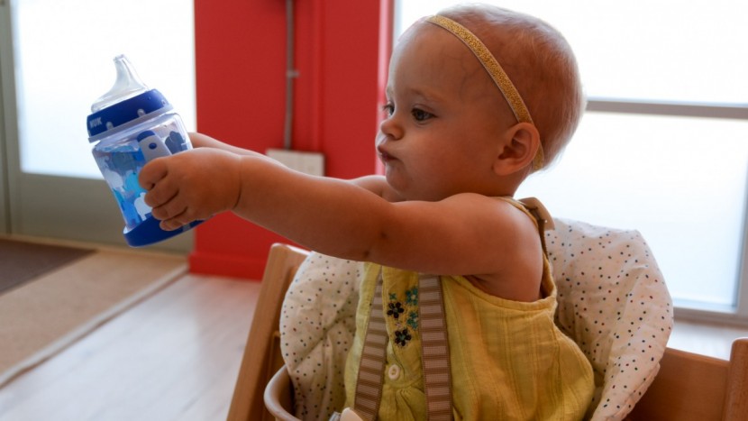 sippy cup - the nuk lerner is 100% leak-proof but harder to drink from.