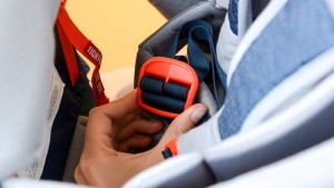The Elite child harness is tightened or loosened using a single...
