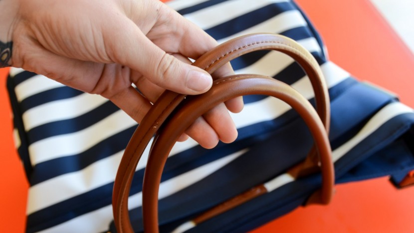 genuine leather handles add an extra touch of class to the abby.