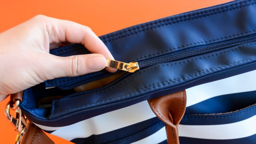 sturdy metal hardware on the zippers makes it a breeze to open and...