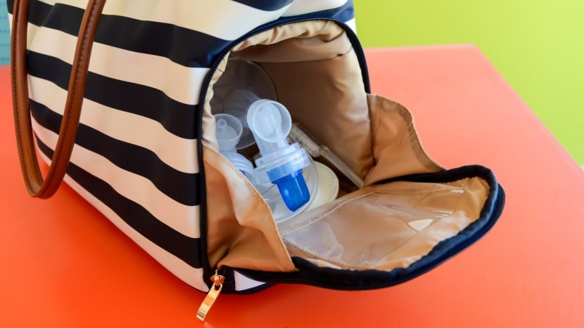 breast pump bag - plenty of room in the spacious pocket for flanges, bottles, tubing...